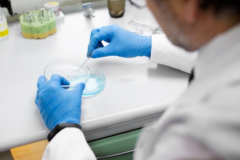 Lab tecchnician preparing petri dishes